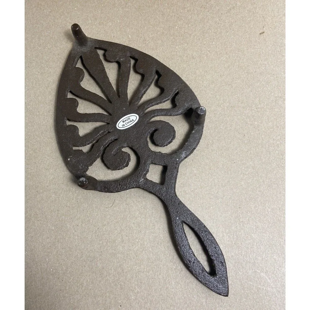 Brown Cast Iron Spade Footed Metal Trivet with handle 9.25 inches long